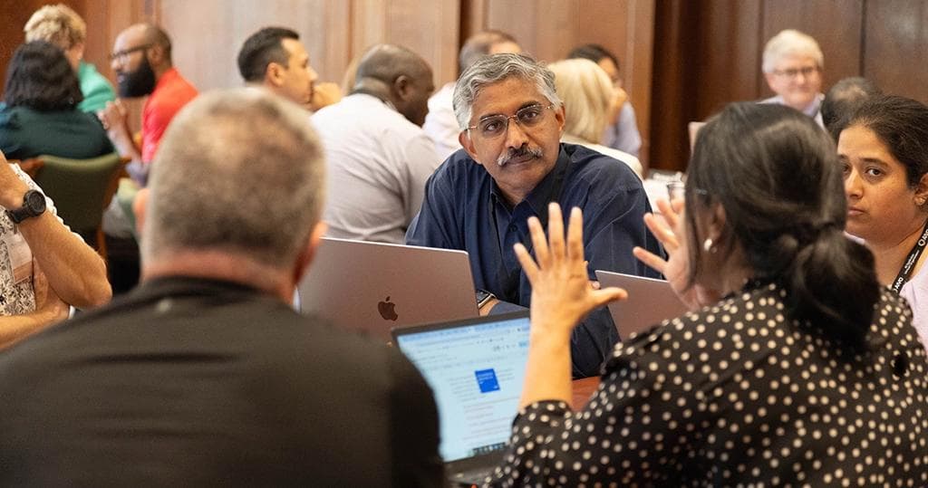 Vikram Adve, Director and Principal Investigator, AIFARMS (center), in a breakout session at the AI for Agriculture Summit and Visioning Conference