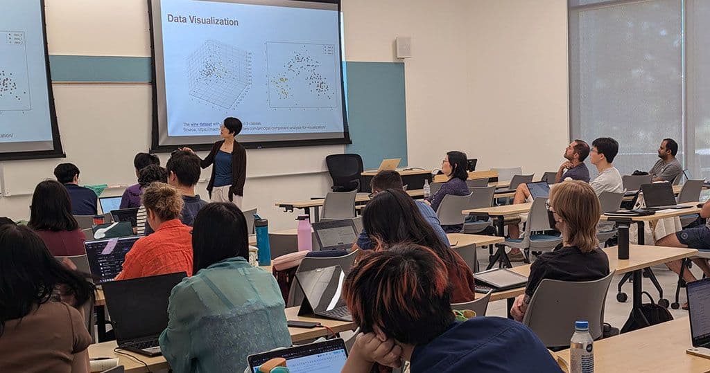 Adult students listening to Professor Liu during the AIBridge Boot Camp
